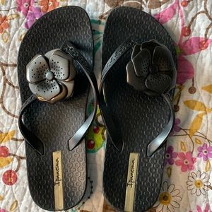 Black Ipanema flip flops